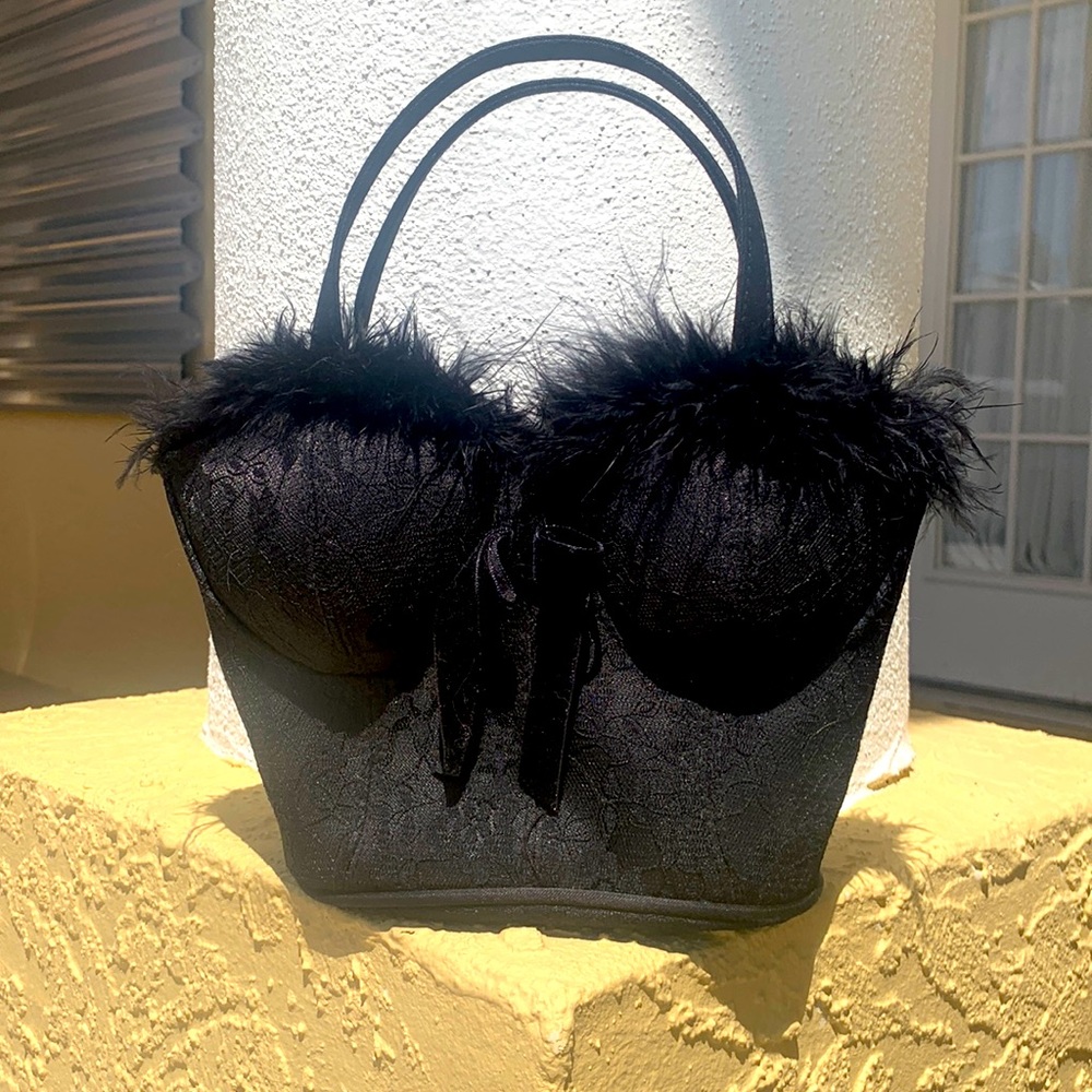 Like new, whimsical black bustiers purse. Fun for costumes or girls night out.